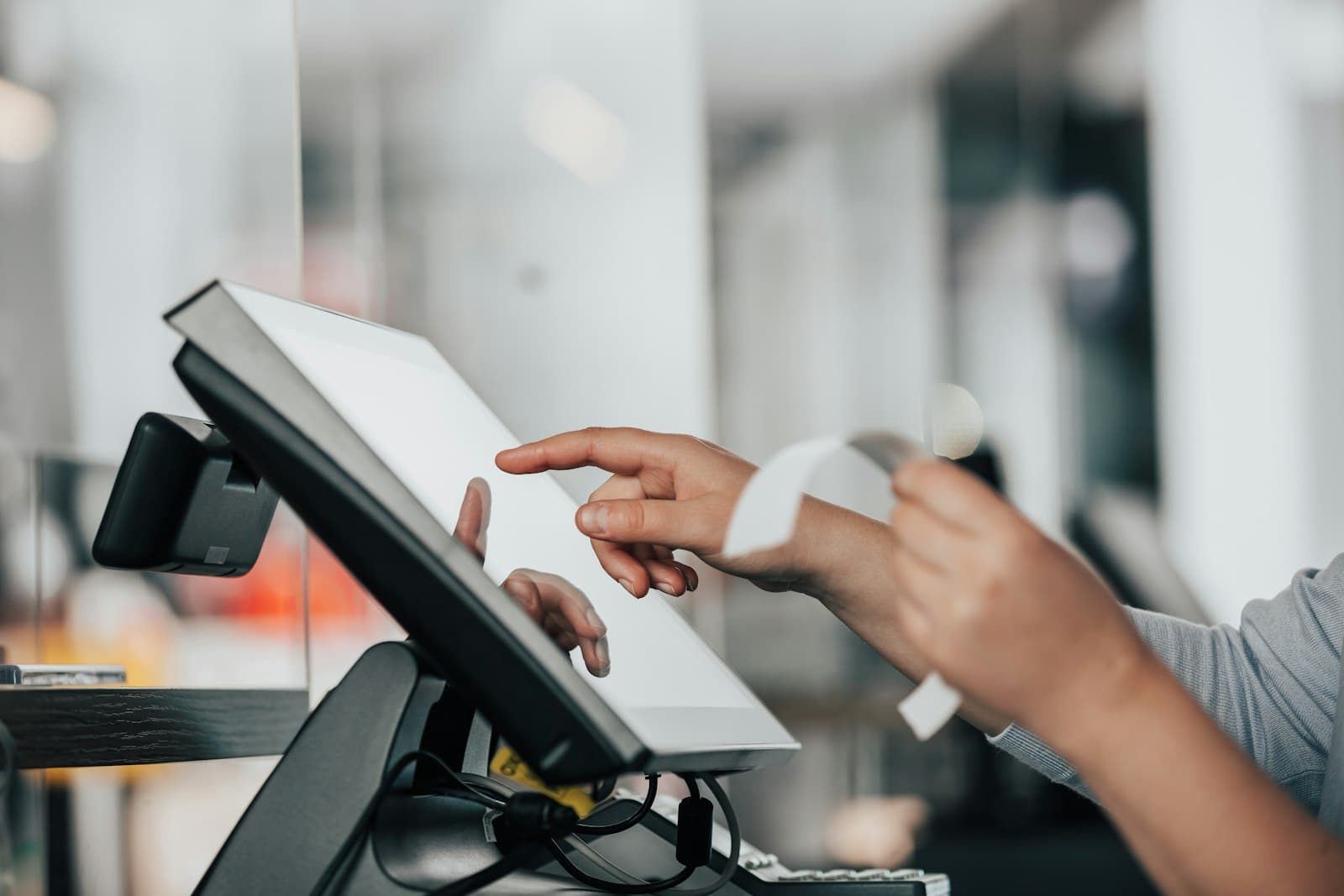 Merchant processing a payment on a point-of-sale terminal